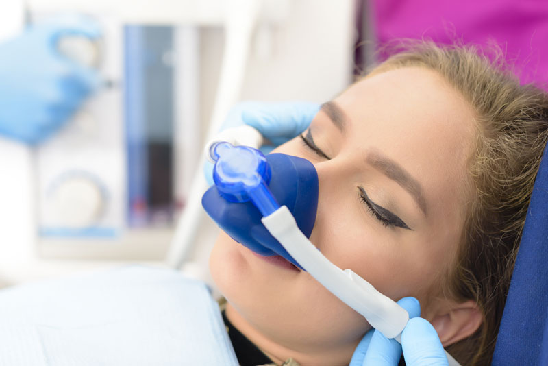 a dental implant patient undergoing inhaled sedation dentistry